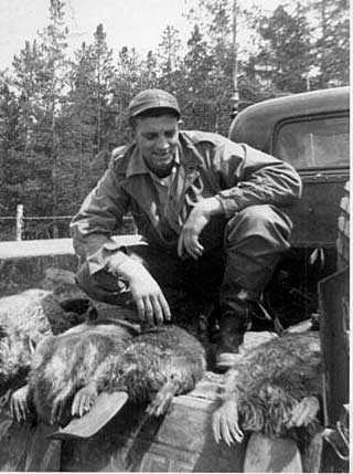 Charles Dobbins with beavers - 1950's